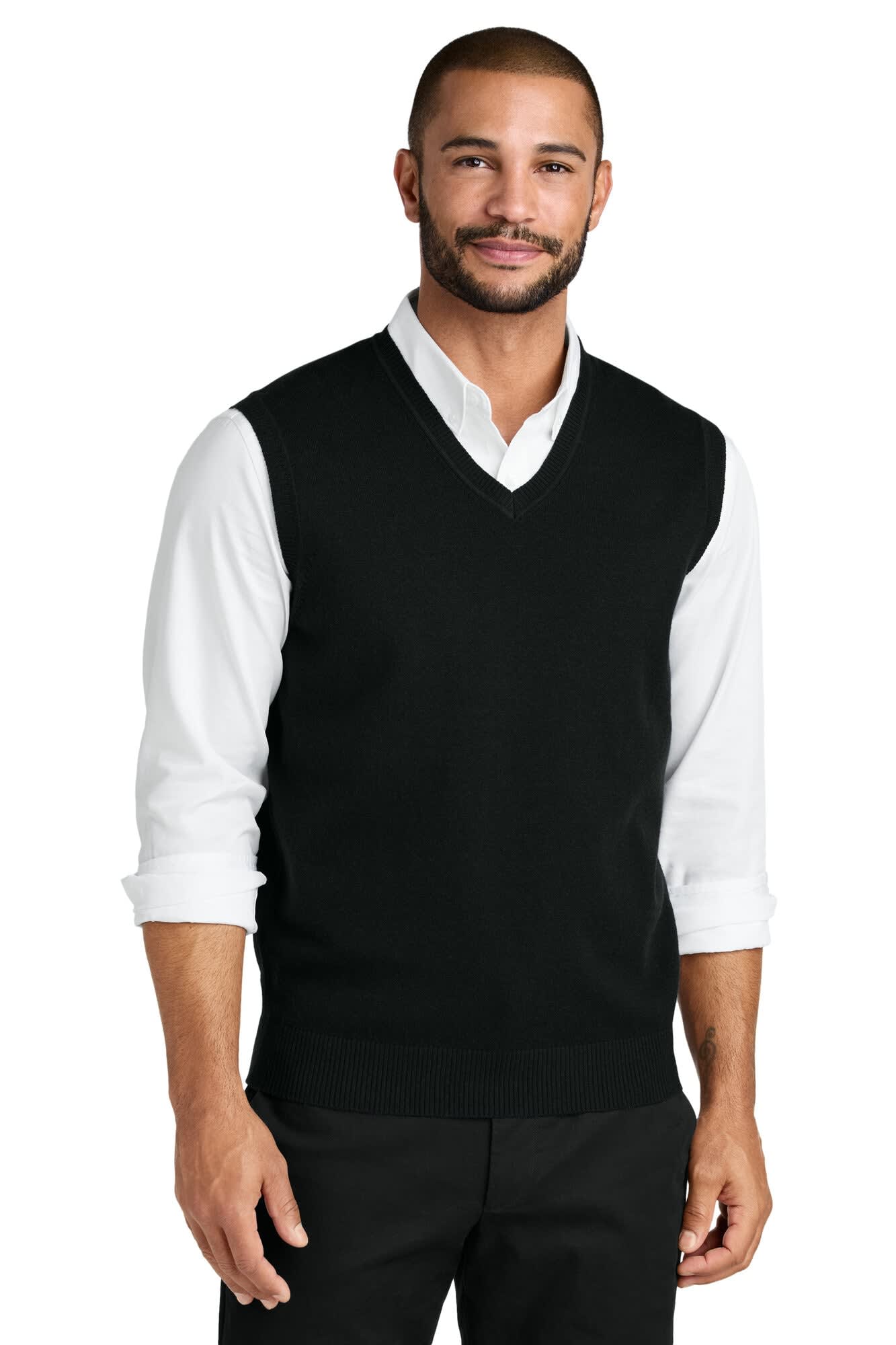 A black sweater vest with a V-neck design, worn over a white collared shirt by a male model. It features a logo.