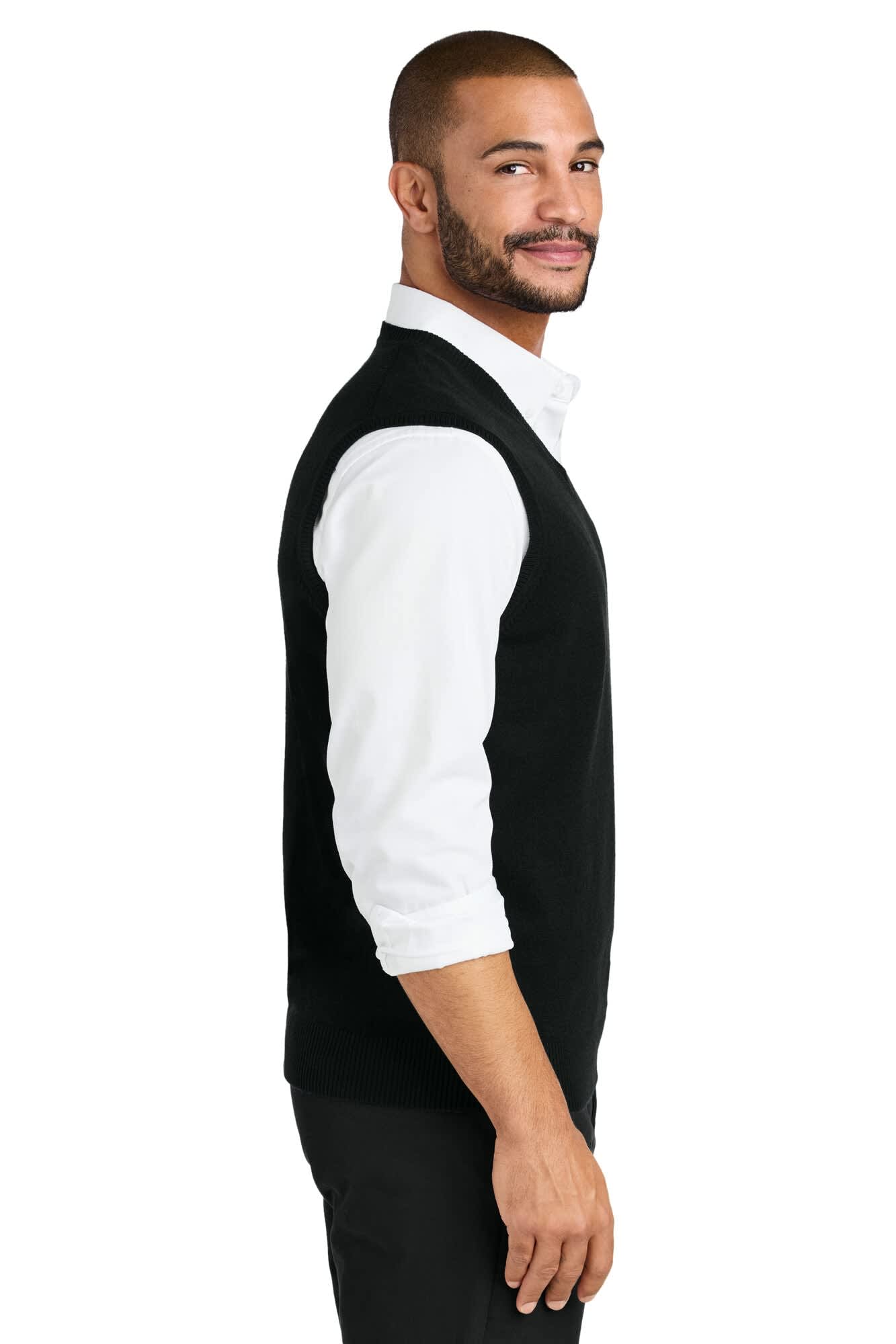 A black sweater vest is worn by a man, featuring a clean-cut design and a logo on the garment.