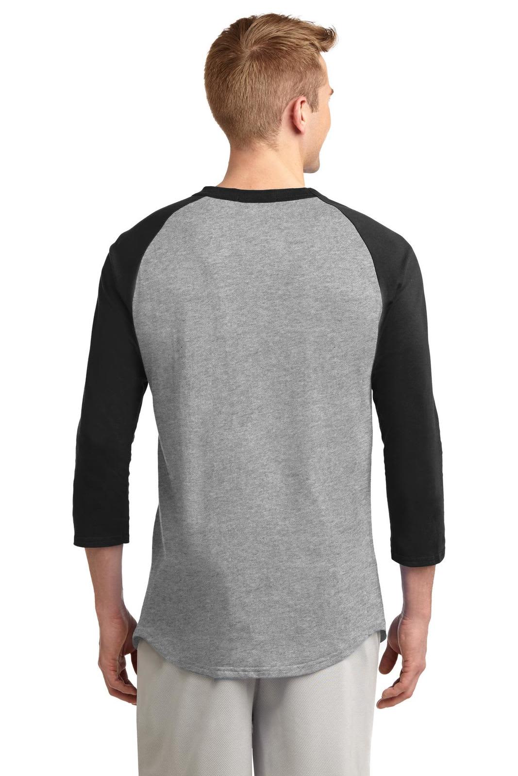 A man is wearing a grey and black Sport-Tek Colorblock Raglan Jersey, showcasing a raglan sleeve design.