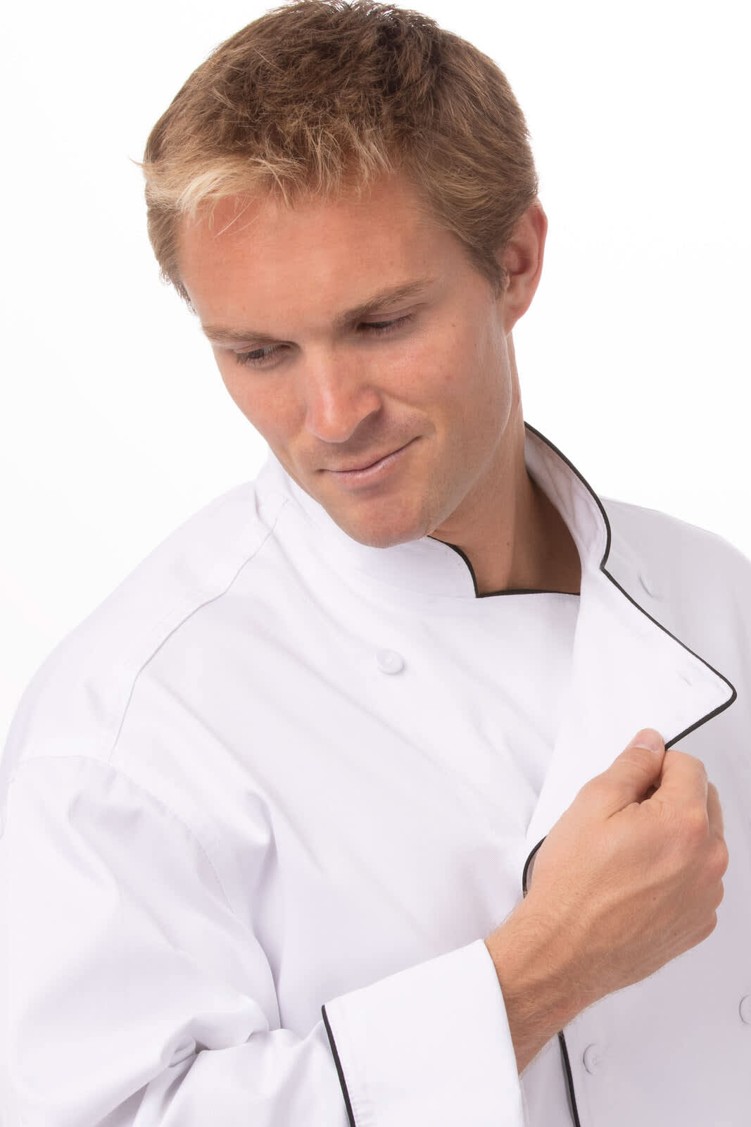A man wears a white executive chef jacket with black piping, featuring a classic collar and a logo.