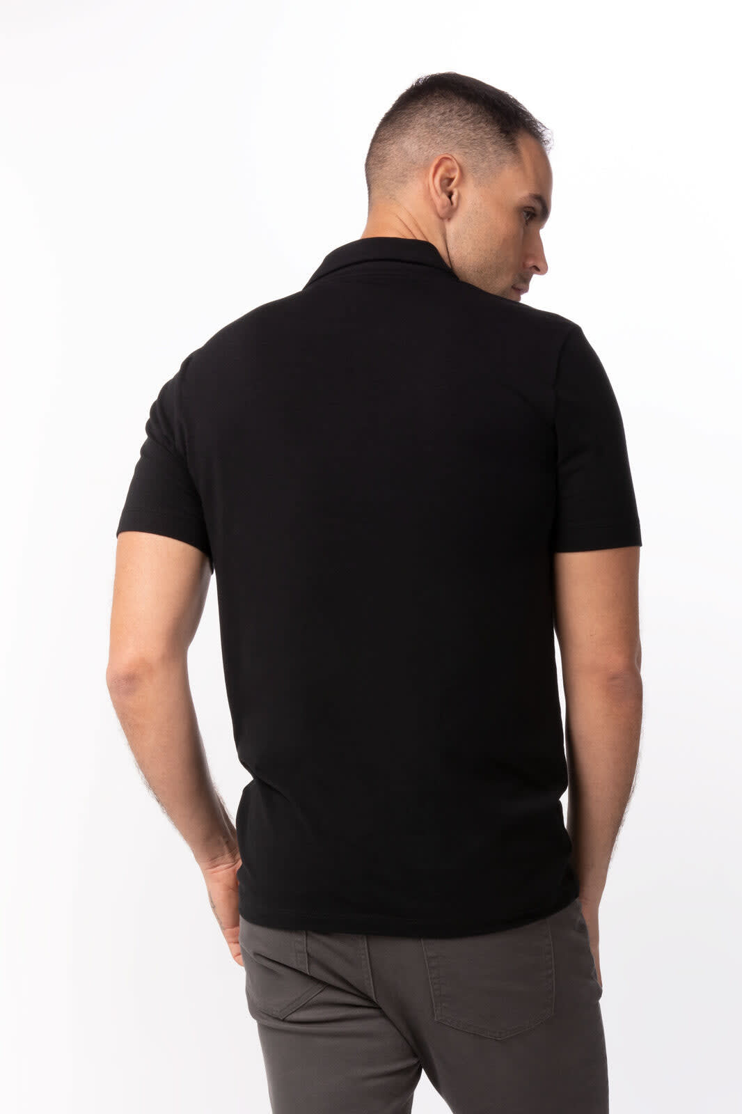 A black polo shirt displayed on a model from the back, featuring a collar and short sleeves. The shirt has a logo.