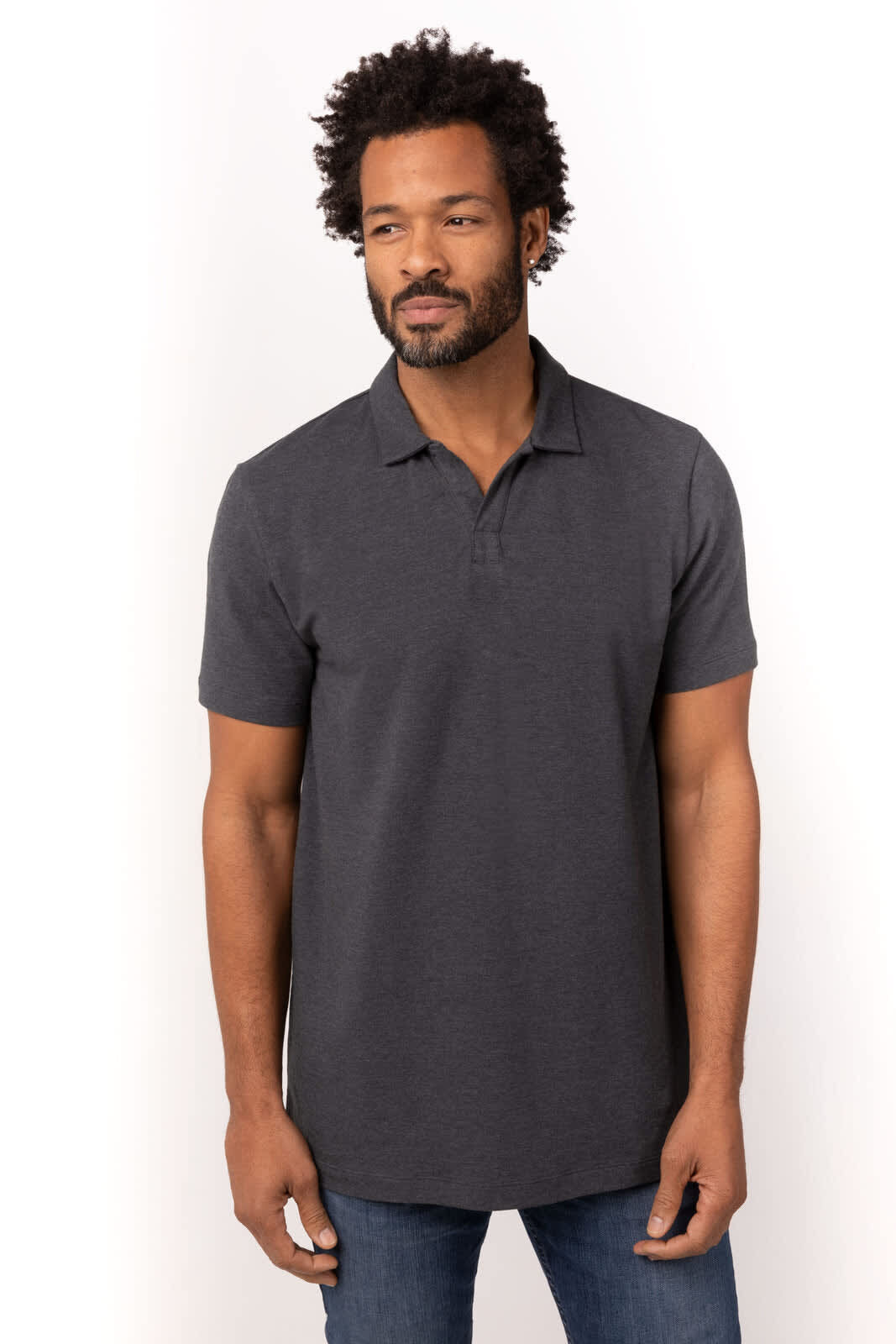 A dark grey polo shirt on a model, featuring a collar and short sleeves, with a logo on the chest.