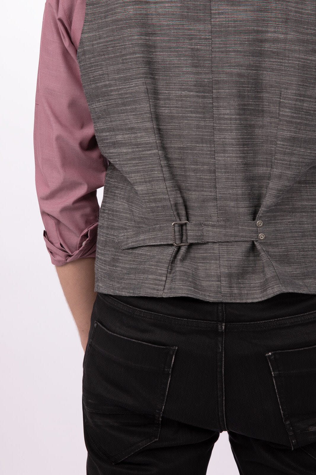 A grey men's vest with a textured pattern, featuring adjustable straps, worn over a pink shirt.