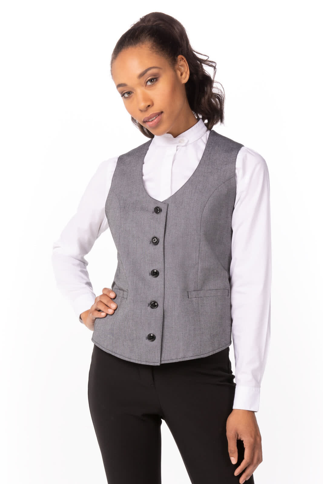 A grey women's vest with a fitted design, featuring a high neck and button closure, styled over a white shirt.