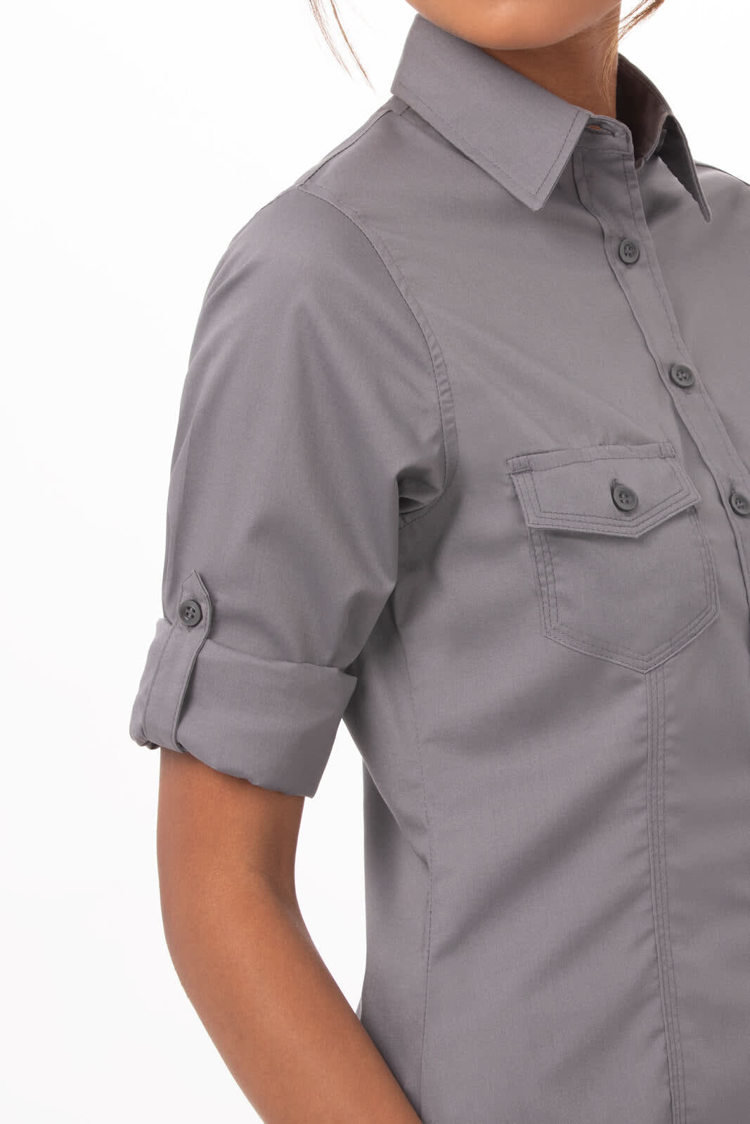 A grey button-up women's shirt features rolled-up sleeves and two chest pockets, with a logo present.