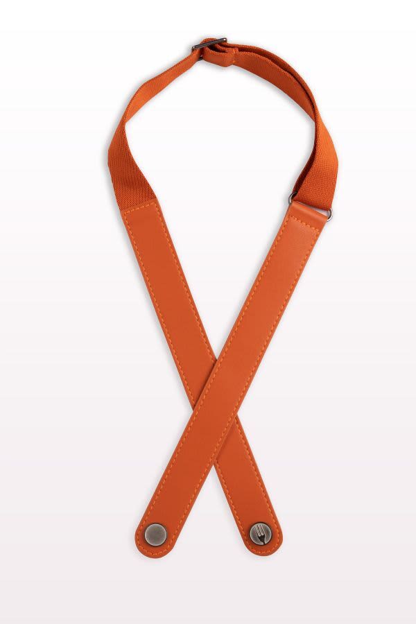 An orange apron neck strap featuring crossed design and metal fasteners. The material appears durable and flexible.