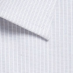 A close-up of a light blue and white patterned shirt fabric with a subtle geometric design.