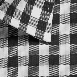 A close-up of a black and white checked button-up shirt, featuring a folded collar and textured fabric.