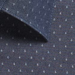 A dark navy chambray fabric featuring small, light-coloured patterns and a collar edge. It includes a logo.
