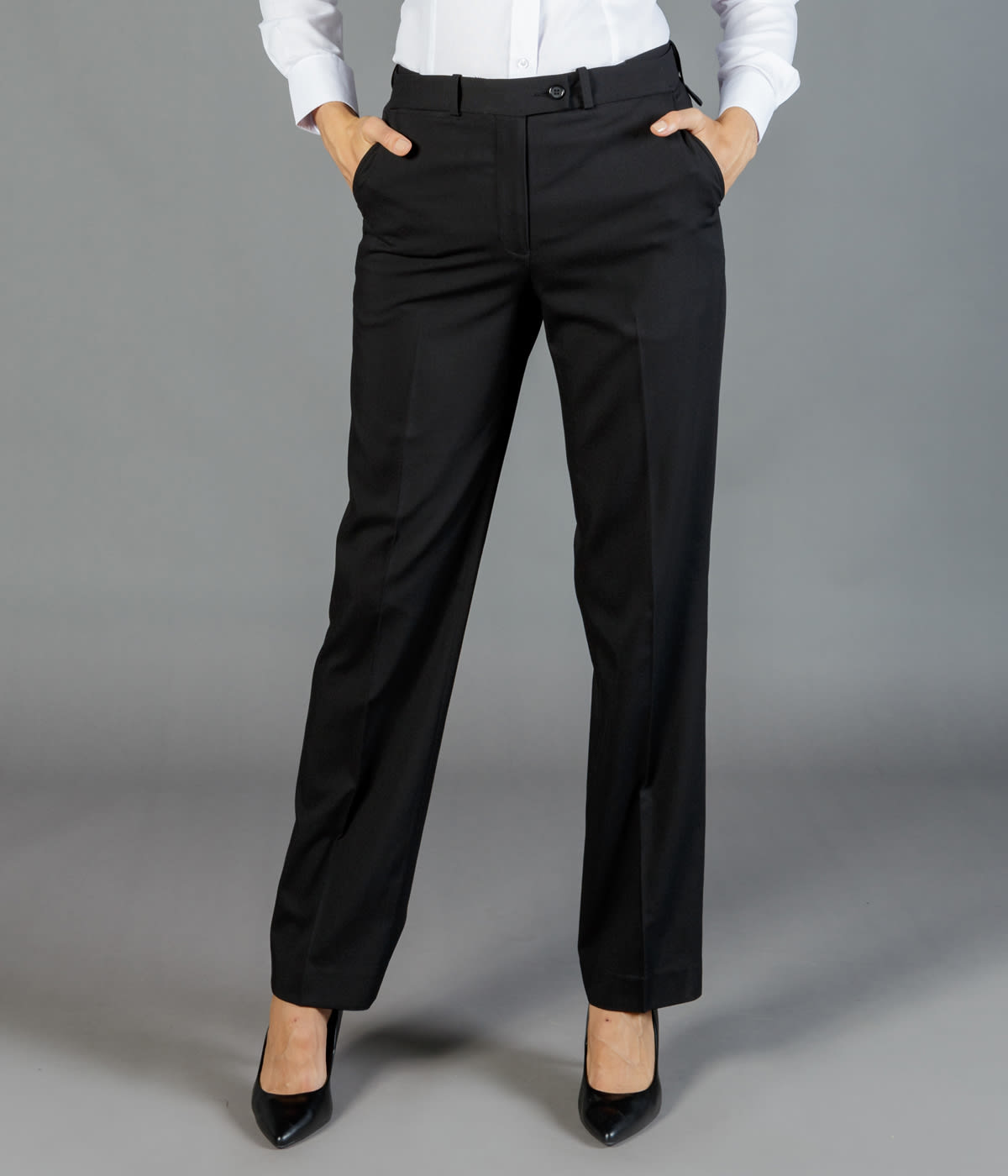 Black slacks with a straight fit and pockets, styled with a white shirt and black heels. Features a logo.