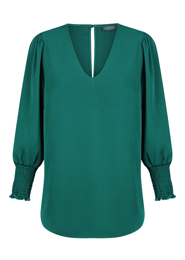 A green Cleo V Neck shirt with balloon sleeves and smocked detailing at the cuffs, featuring a keyhole back.