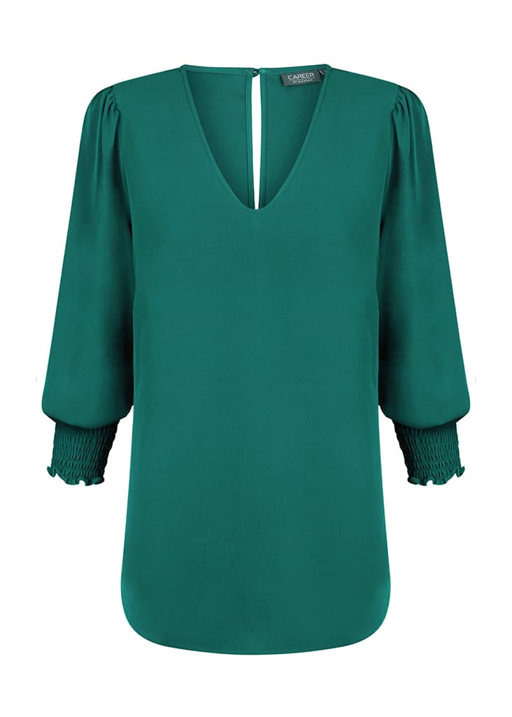 A green Cleo V Neck shirt with puffed sleeves and a smocked cuff detail, featuring a keyhole back.