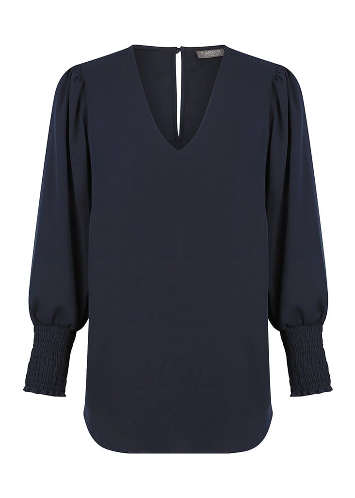 A navy blue V-neck shirt with puffed sleeves and smocked cuffs. Includes a branding logo on the neckline.