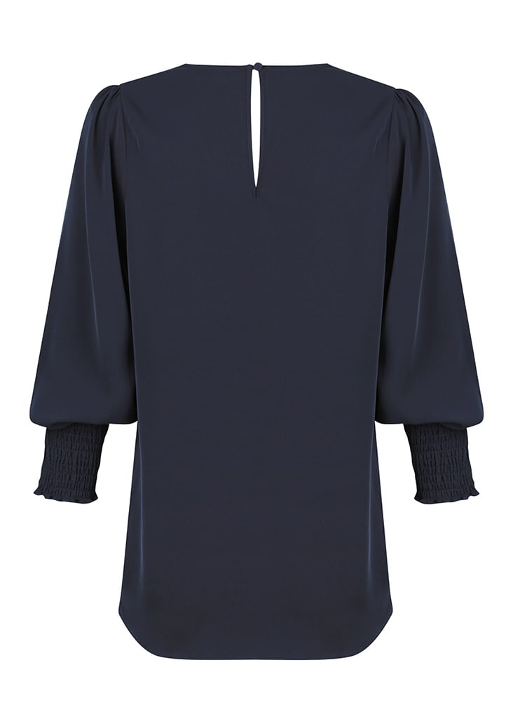 A navy blue shirt with puffed sleeves and smocked cuffs, featuring a keyhole back design and no visible branding.