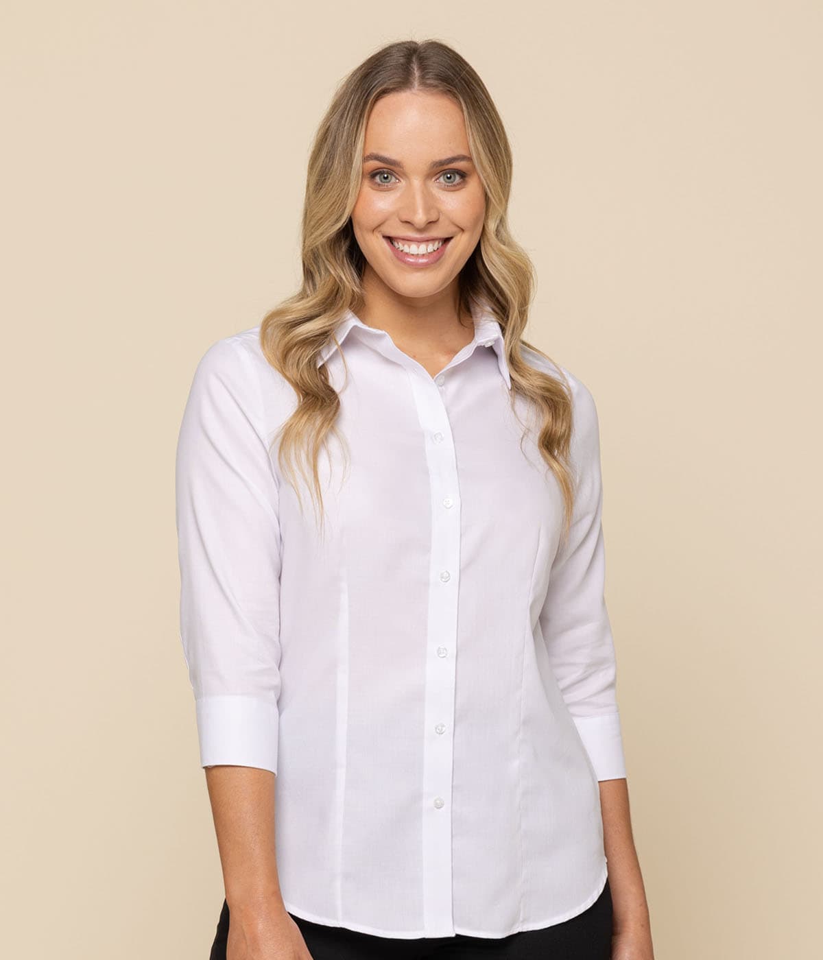 A model wearing a white button-up shirt with three-quarter sleeves, featuring a logo on the chest.