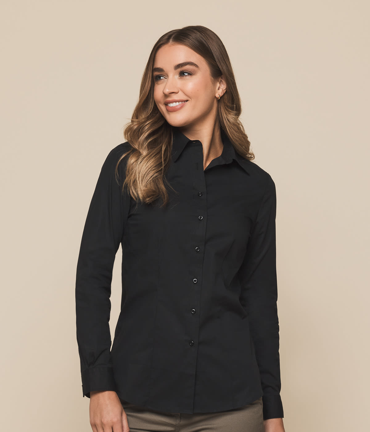 A button-up shirt in black, featuring a classic collar and a fitted design, displayed on a model.