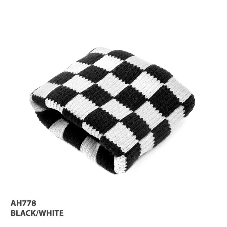 A checkered wrist band in black and white, featuring a knitted pattern and showcasing a logo.