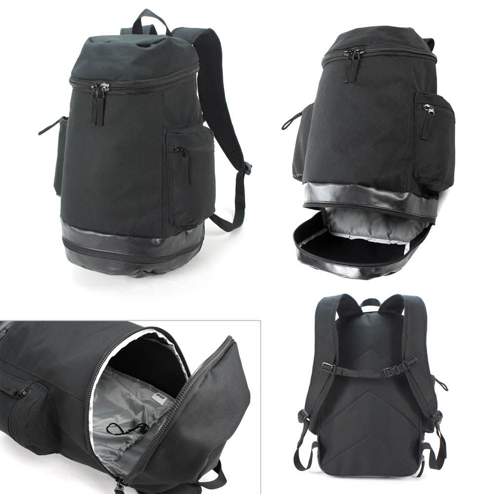 A black backpack with multiple compartments and zippers, featuring a sleek design and a logo on it.