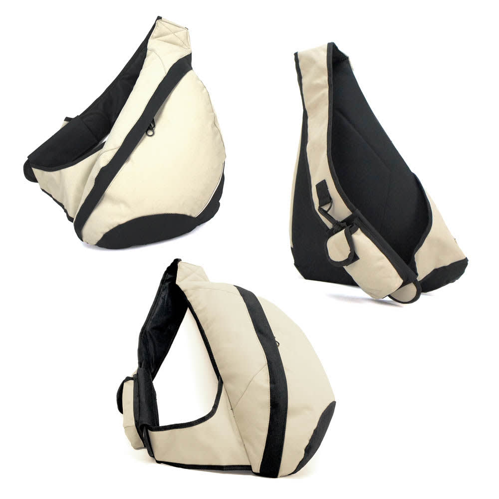 A Slingpack in cream and black, featuring a single shoulder strap, zippered compartments, and a sleek design.