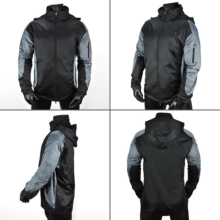 A black and grey Escapade Jacket featuring a zip front, hood, and multiple pockets. It has a logo on the chest.
