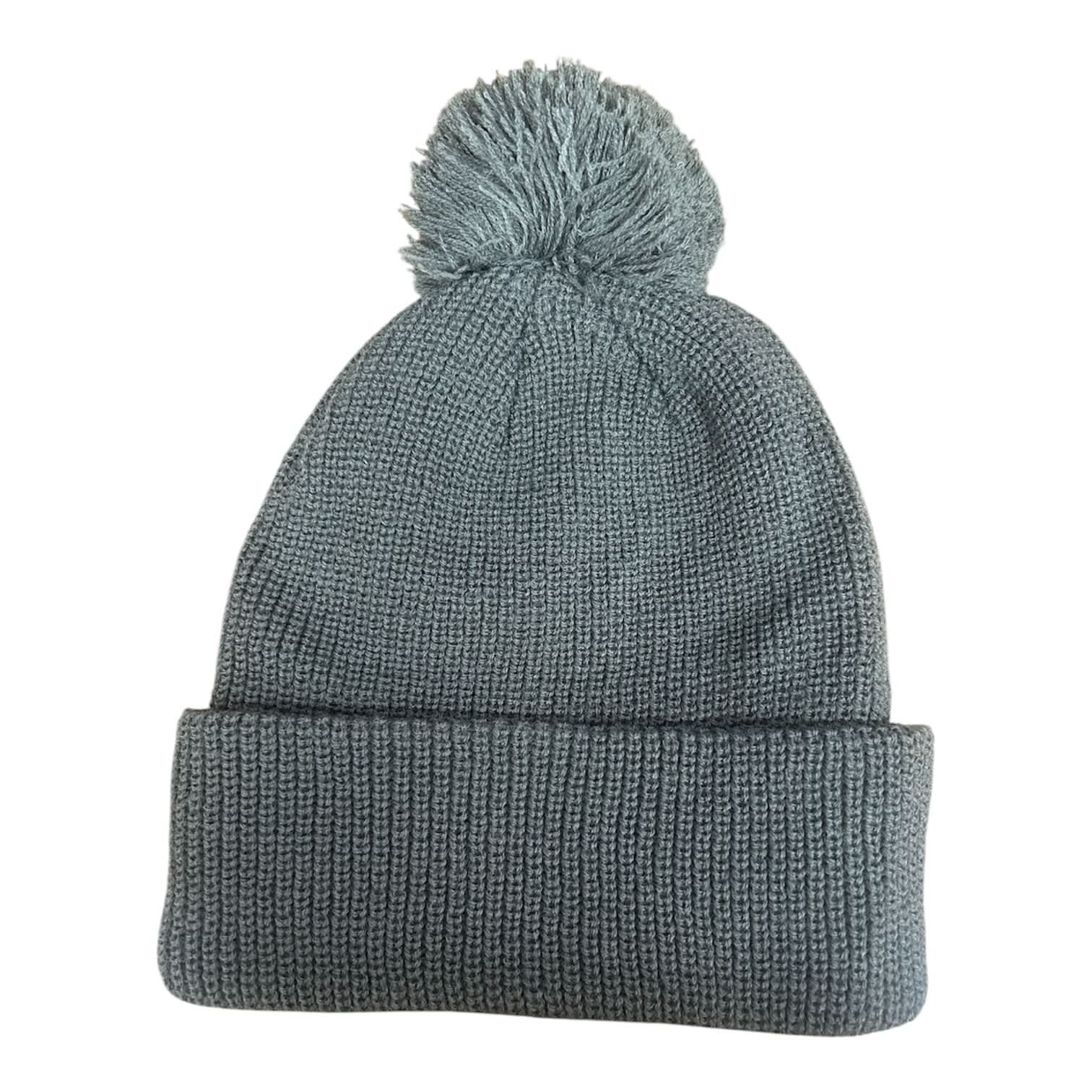 6 SEAM KNITTED BEANIE W/- POM POM HE-3061 A grey knitted beanie with a pompom on top, featuring a folded cuff at the bottom and a logo.