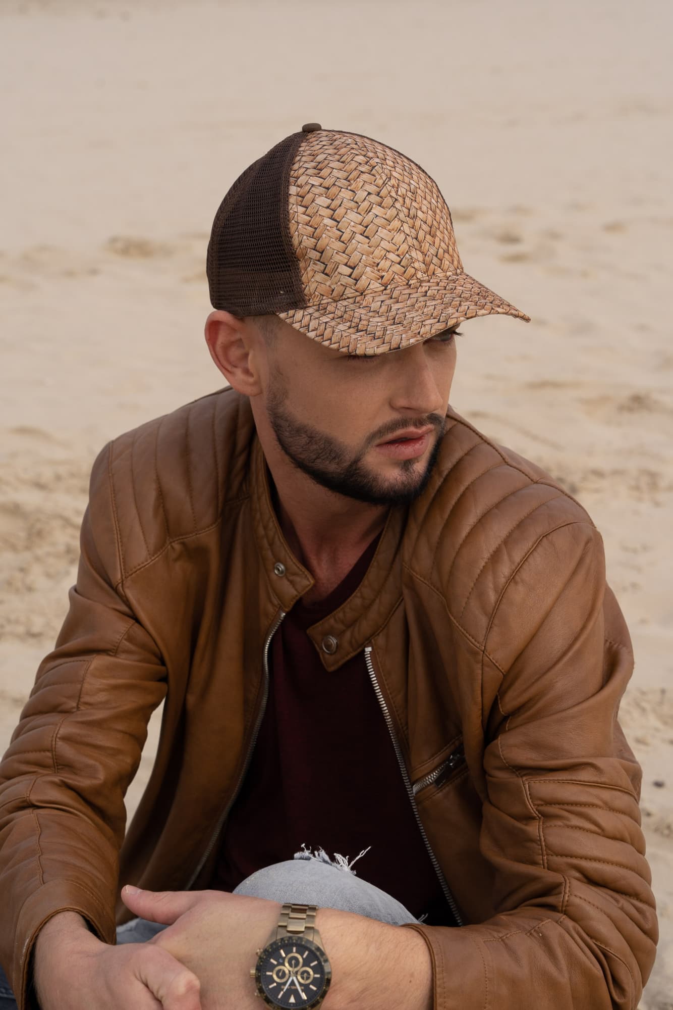 Cane Print with Mesh Back HE-3999 A stylish cap featuring a cane print design with a mesh back, worn by a man in a brown leather jacket.