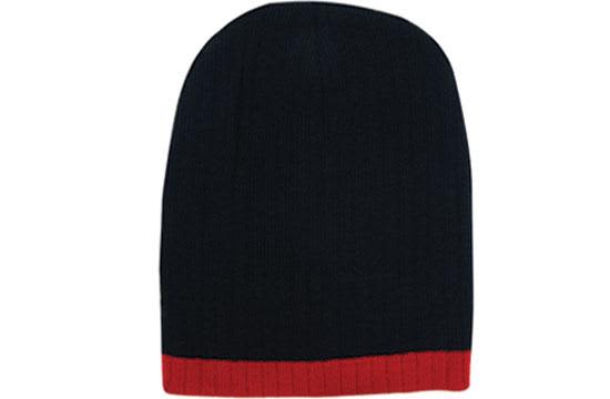 Two Tone Cable Knit Beanie - Toque HE-4195 A two-tone cable knit beanie in navy blue with a red ribbed cuff, featuring a logo.