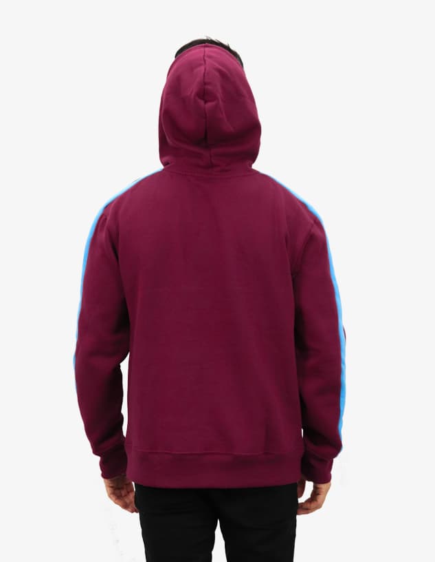 A maroon hoodie with a blue stripe along the sleeves and a hood. It features a logo on the back.