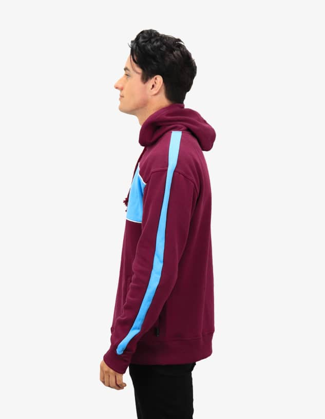 A burgundy hoodie with blue side panel accents and a hood, featuring a branding logo.