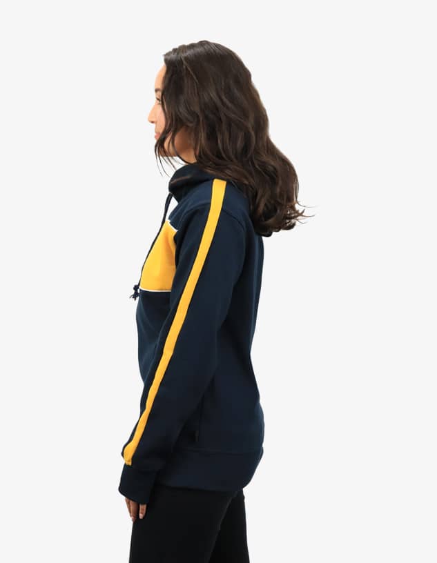 A navy and yellow hoodie with a kangaroo pocket and logo, displayed on a model from the side.