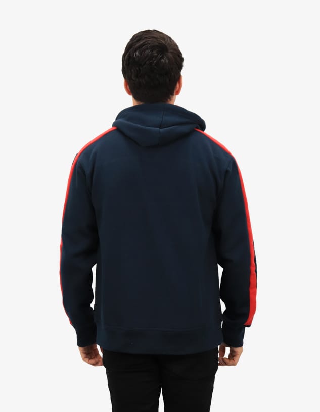 A navy blue hoodie with red side stripes and a hood, featuring a logo on the back.