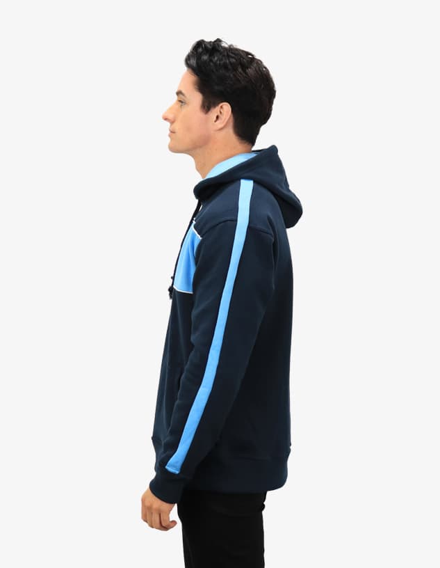 A navy blue hooded jumper featuring light blue accents, displayed on a model from the side.