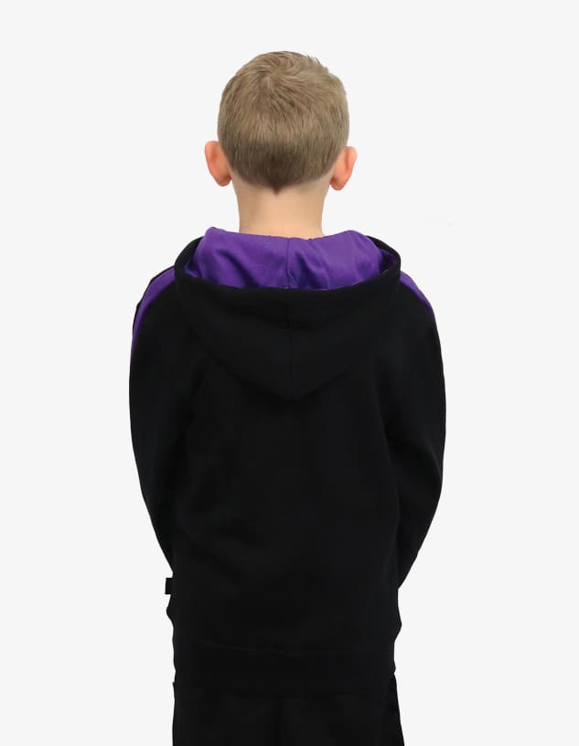A child's hoodie in black with a purple hood and detailing, viewed from the back. Features a logo.