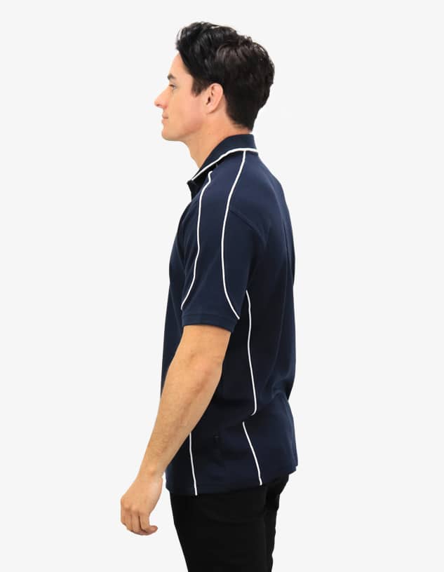 A navy polo shirt with white contrast detailing, featuring a logo on the chest and a side view of a model.