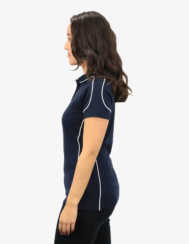 A navy polo shirt with white contrast piping, displayed on a model from the side. Includes branding.