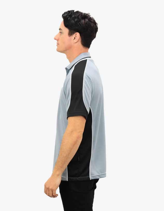 A grey and black polo shirt featuring a logo, displayed on a model from the side.
