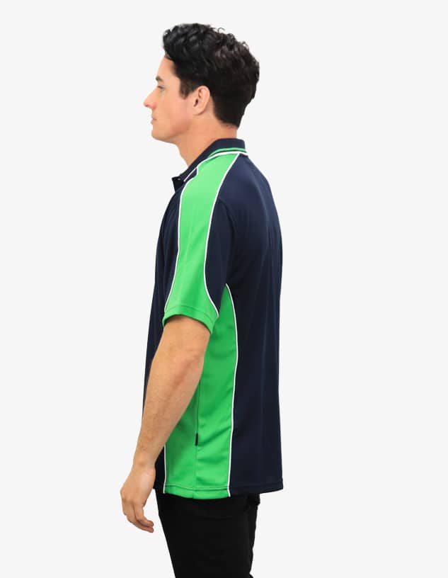 A navy and green polo shirt featuring a logo, displayed from the side on a model.