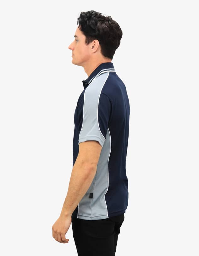 A navy and light grey polo shirt featuring a logo, shown from the side on a model.