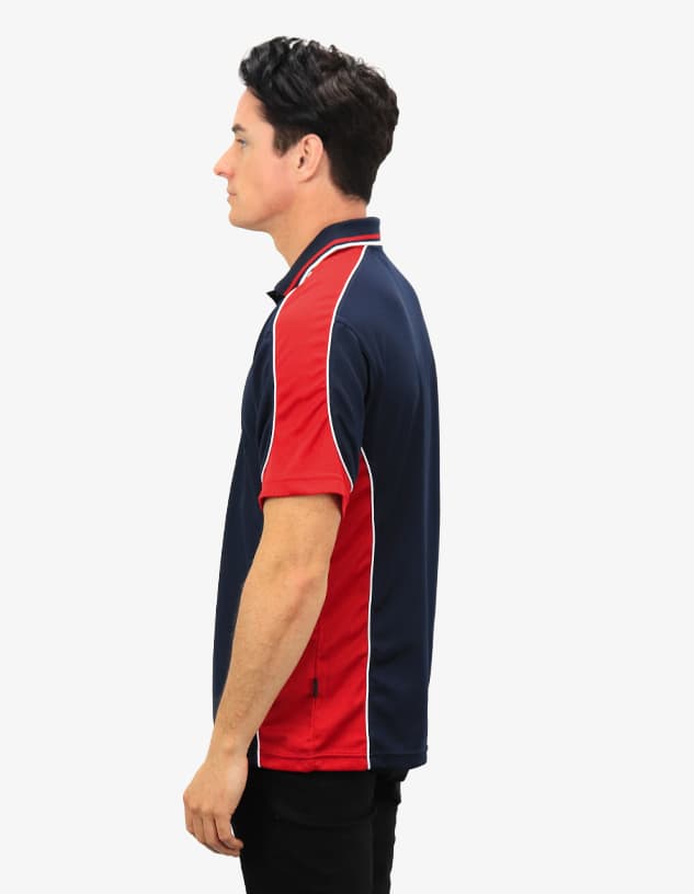 A polo shirt featuring a navy blue body with red and white accents, displayed on a model from the side view.