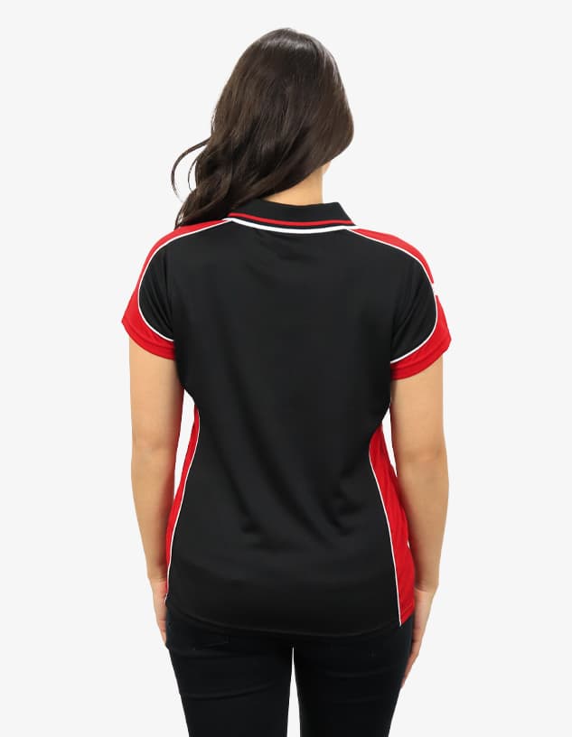 A polo shirt in black with red detailing, featuring a logo. It has a classic collar and short sleeves.