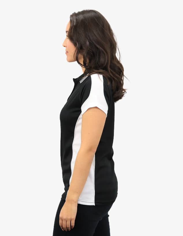 A black and white polo shirt displayed on a model from the side, featuring a logo on the chest.
