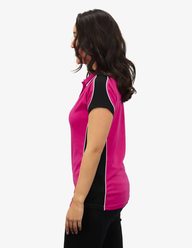 A pink and black polo shirt with contrasting seams, featuring a logo on the chest area.