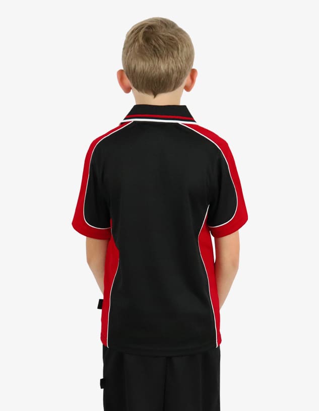 A polo shirt in black and red with white piping, displayed from the back on a child. It features a logo.