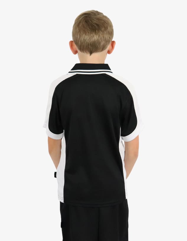 A black and white polo shirt with contrasting sleeves, featuring a logo on the side. Suitable for children.