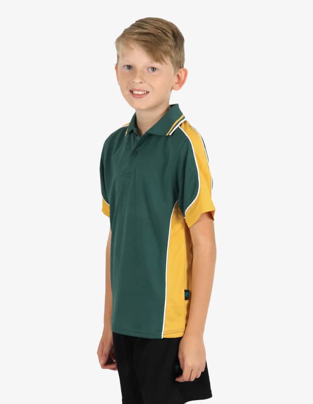 A polo shirt in green and gold, featuring a logo, worn by a young boy.