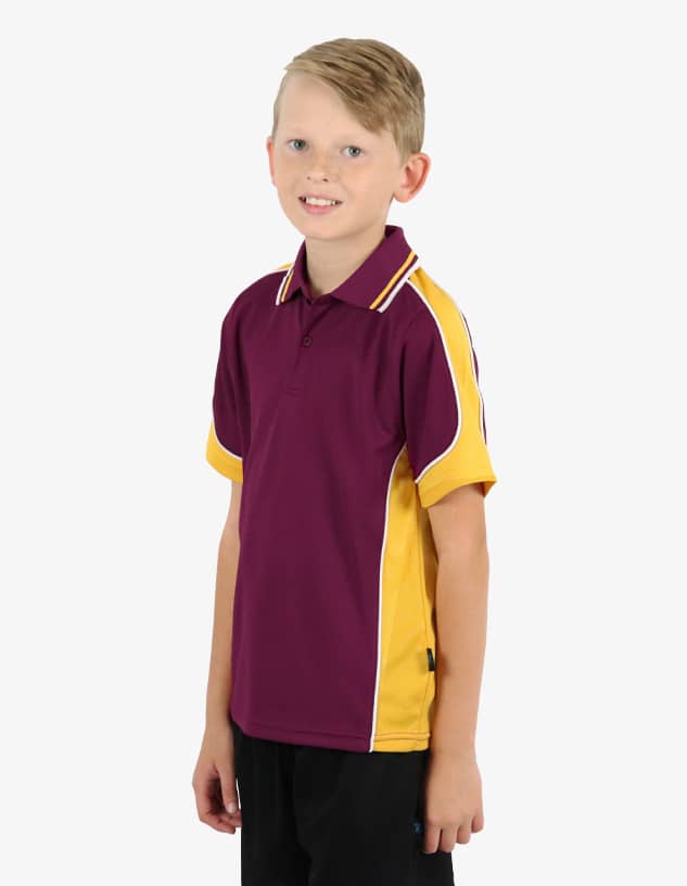 A maroon and yellow polo shirt with a logo on the chest, worn by a young boy.