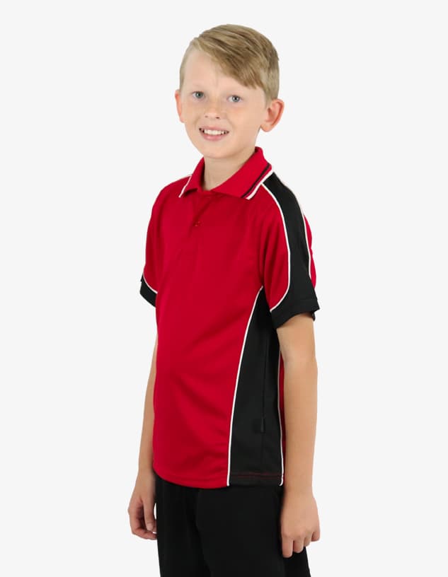 A red and black polo shirt with contrasting side panels, modelled by a smiling child. Includes a logo.