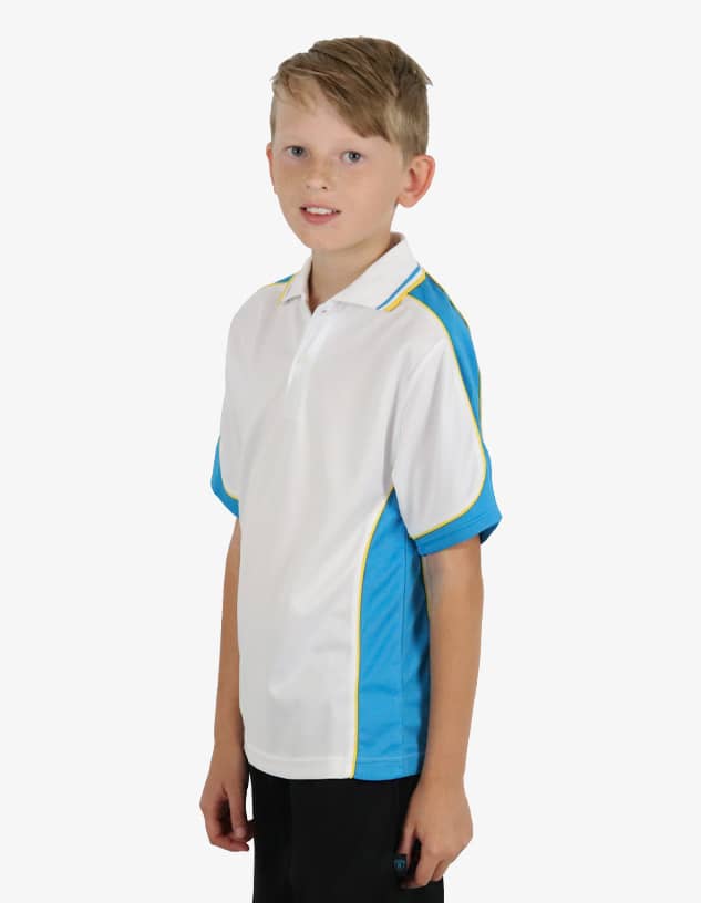 A young boy wearing a white and blue polo shirt with a logo. The shirt features yellow accents on the collar and sides.