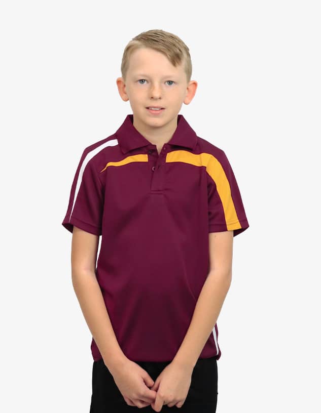 A young boy wearing a maroon polo shirt with yellow and white accents and a logo on the chest.