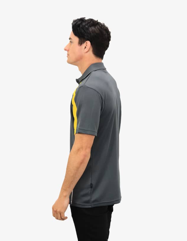 A grey polo shirt with yellow accents, featuring a logo on the chest, displayed on a model from the side.